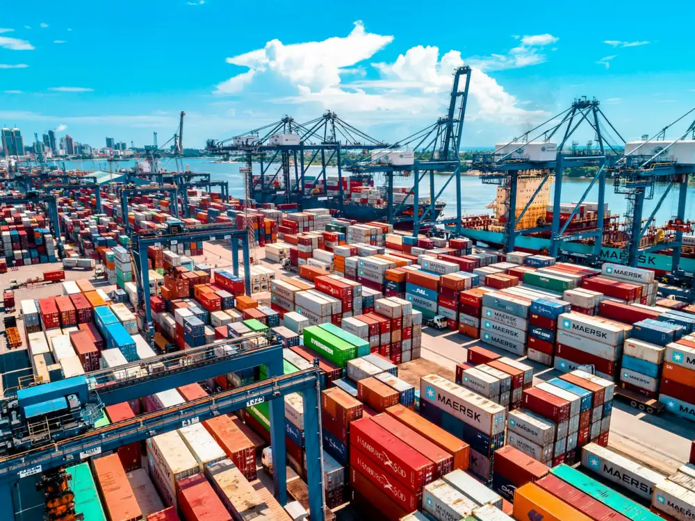 Container terminal with stacked containers and cranes