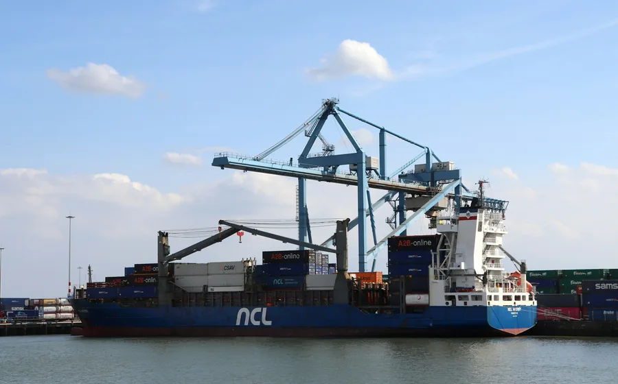 Container ship being loaded at a European port
