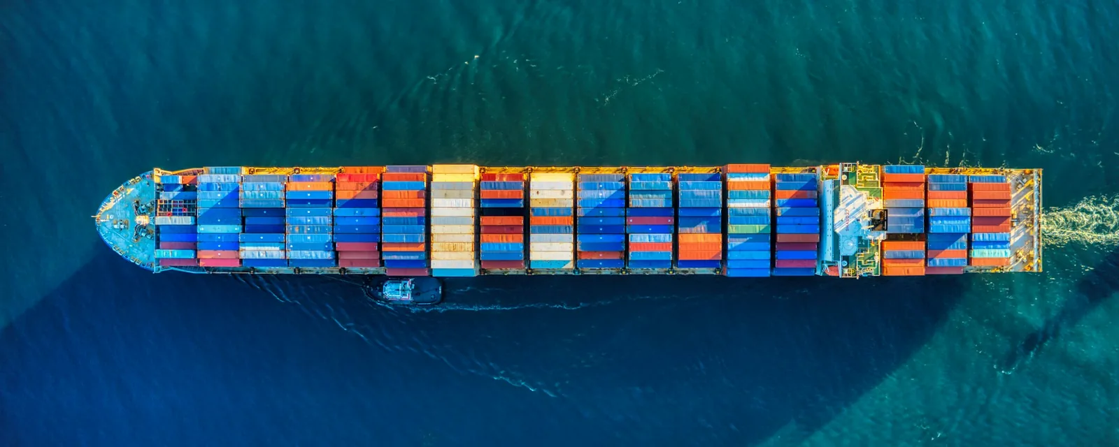 Aerial view of a loaded container ship at sea