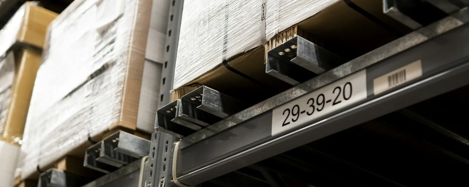 Warehouse rack with boxed goods and a printed location label